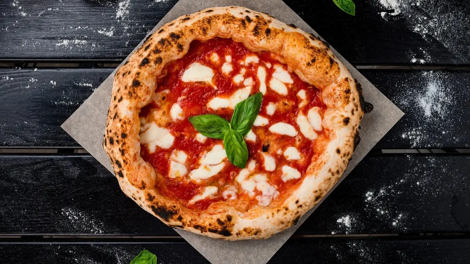 A freshly baked artisanal pizza with a perfectly charred crust.