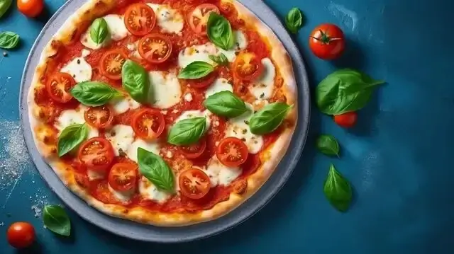 A macro shot of fresh basil on a pizza.