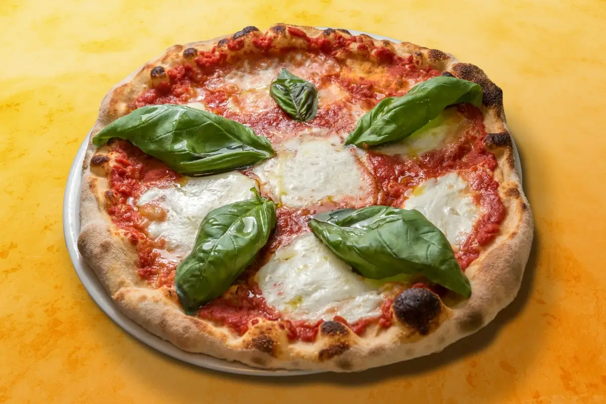 A beautiful Margherita pizza with fresh basil and mozzarella.